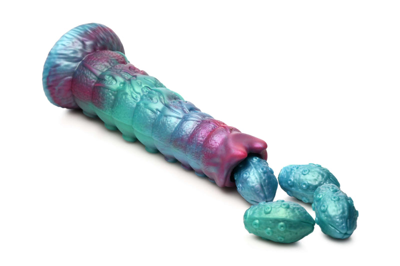 Creature Cocks Galactic Breeder Ovipositor Silicone Dildo in teal, red, and blue with unique egg design.