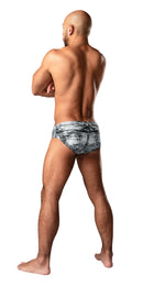 Male Power Dirty Denim Men's Bikini X-Large Blue showcased on a model from the back, emphasizing the unique denim design.