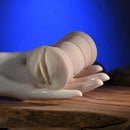 Zero Tolerance Sasha Grey Mini Stroker Vagina displayed on a hand, showcasing its compact and realistic design.