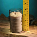 Zero Tolerance Dani Daniels Mini Stroker Vagina displayed next to a ruler for size comparison on a wooden surface.