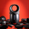 Zero Tolerance Wet It Be vibrating lubricating stroker ring on black stones with red background.
