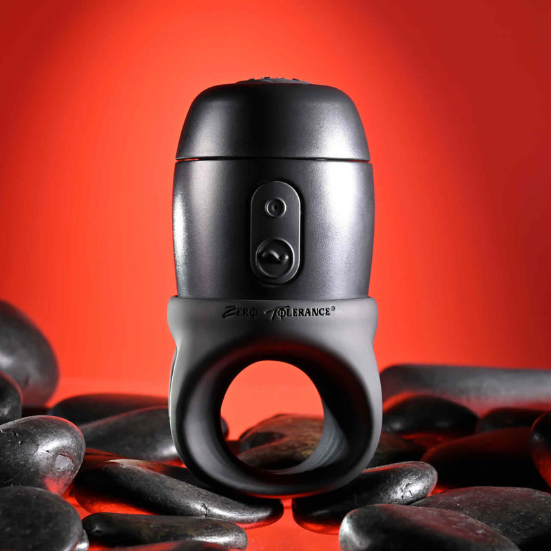 Zero Tolerance Wet It Be vibrating lubricating stroker ring displayed on sleek black stones with a red background