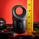 Zero Tolerance Wet It Be vibrating lubricating stroker ring with ergonomic button, displayed next to a measuring tape on a red background.
