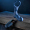 Zero Tolerance By All Means remote control prostate vibrator with flexible shaft, come-hither motion, and ball ring on a wooden surface