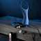 Zero Tolerance By All Means remote control prostate vibrator with USB charging cable on a wooden surface