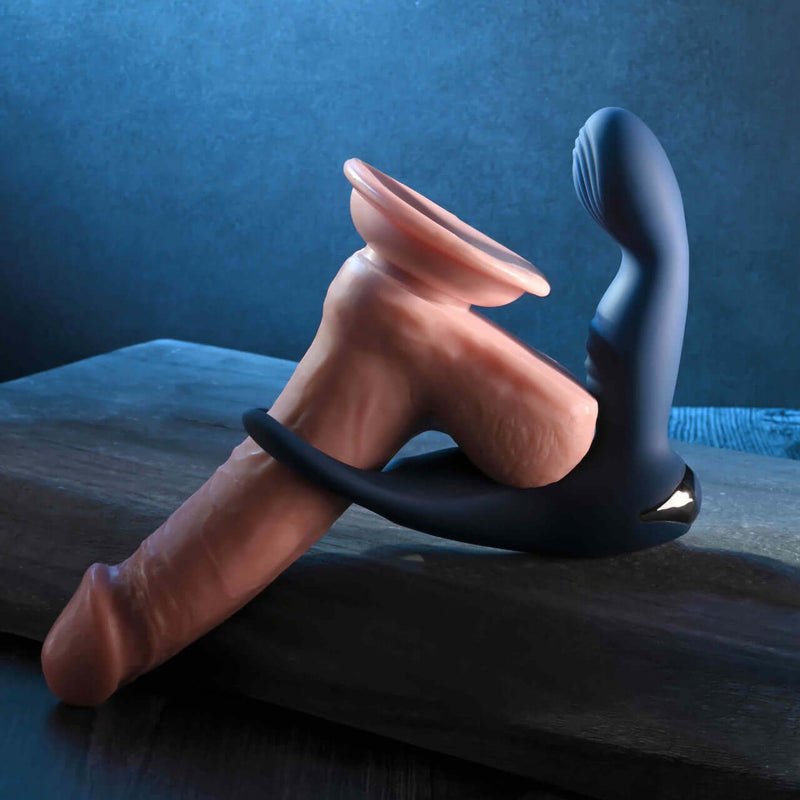 Zero Tolerance By All Means remote control prostate vibrator with open-ended ball ring on display.