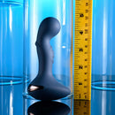 Zero Tolerance Blue Oasis vibrating silicone plug with measuring tape showcasing its size against a blue background.