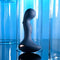 Blue Oasis vibrating silicone plug with textured shaft and ergonomic handle in sleek design.