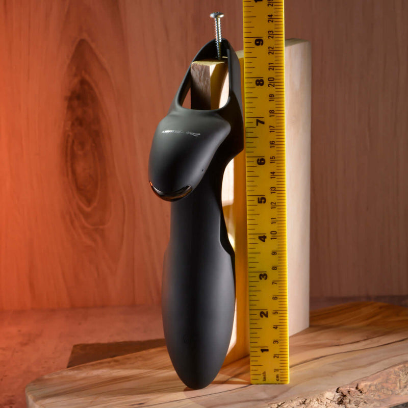 Zero Tolerance Nautilus rechargeable silicone dual cock ring displayed next to a ruler for size comparison.