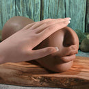 Channel Heart Movie & Realistic Kiss & Tell Stroker with a hand gently resting on a lifelike face.