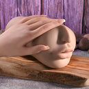 Riley Reid Movie Download with Realistic Kiss & Tell Stroker shown with a hand touching the life-like toy.