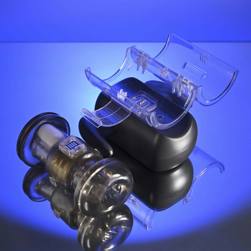 Zero Tolerance Hold Me Tight Heated Stroker Black on reflective surface with blue background