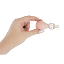 Hand holding the Size Matters Perfect Fit Nipple Enlarger Pump Set showcasing its ergonomic design.