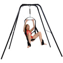 Trinity Ultimate Sex Swing Stand with model demonstrating suspended play in a red outfit