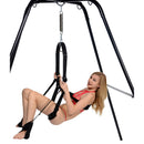 Trinity Ultimate Sex Swing Stand with a model demonstrating its use in a playful setting.