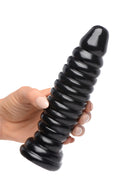 Master Series Obsession 11 Ribbed Anal Plug Black held in hand, featuring glossy finish and ribbed design.