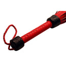 Strict Leather Heavy Tail Flogger Red and Black with braided handle and contrasting colors.
