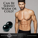 Master Series Jaded Glass Ben Wa Balls Green displayed alongside a man, emphasizing versatility to be served warm or cold.