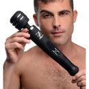 A man holding the Zeus Arcana Electro Vibe Wand Black, showcasing its sleek design and control panel.