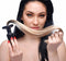 Woman holding a blonde ponytail butt plug, showcasing its silky texture and tapered design.