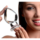 Prisms Molten Wide Glass Butt Plug Clear held by a smiling woman showcasing its clear design and polished finish.