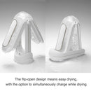 Flip 0-Zero Electronic Vibration Stroker shown with flip-open design for easy drying and simultaneous charging.