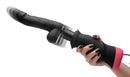 LoveBotz Mega-Pounder Handheld Thrusting Silicone Dildo held in hand featuring realistic details and powerful thrusting capability.