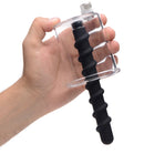 Rosebud Driller Cylinder with Silicone Swirl Insert held in hand, showcasing advanced anal pumping and penetration accessory.