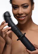 The Large Realistic 10X Silicone Vibrator with Handle held by a smiling person, showcasing its lifelike detail and grip.