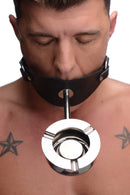 Master Series Ashtray Ball Gag Black worn by a person, featuring a silicone gag and metal ashtray.
