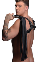 Strict Leather Flogger with Stainless Steel Handle showcased on a model with tattooed arm.
