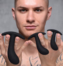 Model holding the Dark Delights 3 Piece Curved Anal Trainer Set, showcasing the graduated plugs.