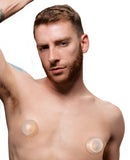 Master Series Clear Plungers Silicone Nipple Suckers Small on a model's chest with a focus on nipple sensitivity.