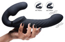 Ergo-Fit Twist Inflatable Vibrating Strapless Strap-On Black held in hand showing its texture and inflation features.