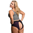 Model showcasing the Lace Envy Crotchless Panty Harness 3XL from behind, highlighting its sexy design.
