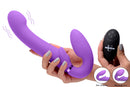 Strap U 10X G-Pulse Vibrating Strapless Strap-On Purple with remote control and inflation features in hand.