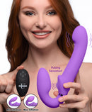 Strap U 10X G-Pulse Vibrating Strapless Strap-On Purple being held by a smiling woman, showcasing its design and features.