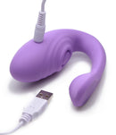 Inmi 7X Pulse Pro Clit Stimulating Vibrator Purple with USB charging cable for enhanced pleasure.