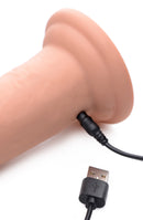Close-up of Swell 7 Inch Inflatable Vibrating Remote Control Dildo showing USB charging connection.