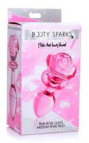 Booty Sparks Pink Rose Glass Anal Plug Medium packaging showing rose-shaped anal plug design in pink.