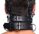 Strict Leather Head Harness with Removable Gag displayed on a model's neck showing adjustable straps and metal hardware.