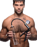 Size Matters Penis Pump Kit with 2 Inch Cylinder held by a muscular man showcasing its features and measurement markings.