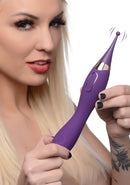 Inmi Power Zinger Pro Pulsing G-spot Pinpoint Vibrator held by a model, showcasing its sleek design and pulsing tip.
