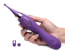 Inmi Power Zinger Pro Pulsing G-spot Pinpoint Vibrator held in hand with interchangeable silicone tips.