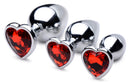 Booty Sparks Red Heart Gem Anal Plug Set features three metal plugs with ruby-red heart-shaped gems.