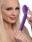 Model holding the 10X Silicone G-Spot Vibrator Purple, showcasing its ergonomic design and vibrant color.