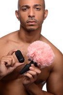 Vibrating Silicone Anal Plug with 3 Interchangeable Tails, remote control and pink tail, showcasing versatility.