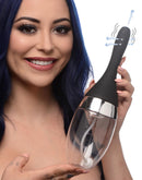 CleanStream Auto-Vibrating Enema Bulb Black held by a smiling woman, showcasing its sleek design and advanced features.