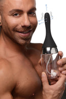 CleanStream Auto-Vibrating Enema Bulb Black held by a man with a smile, showcasing its sleek design and features.