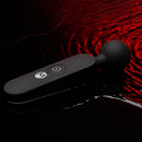 Master Series 72X Silicone Heating Wand Massager Black on a reflective surface with red lighting.